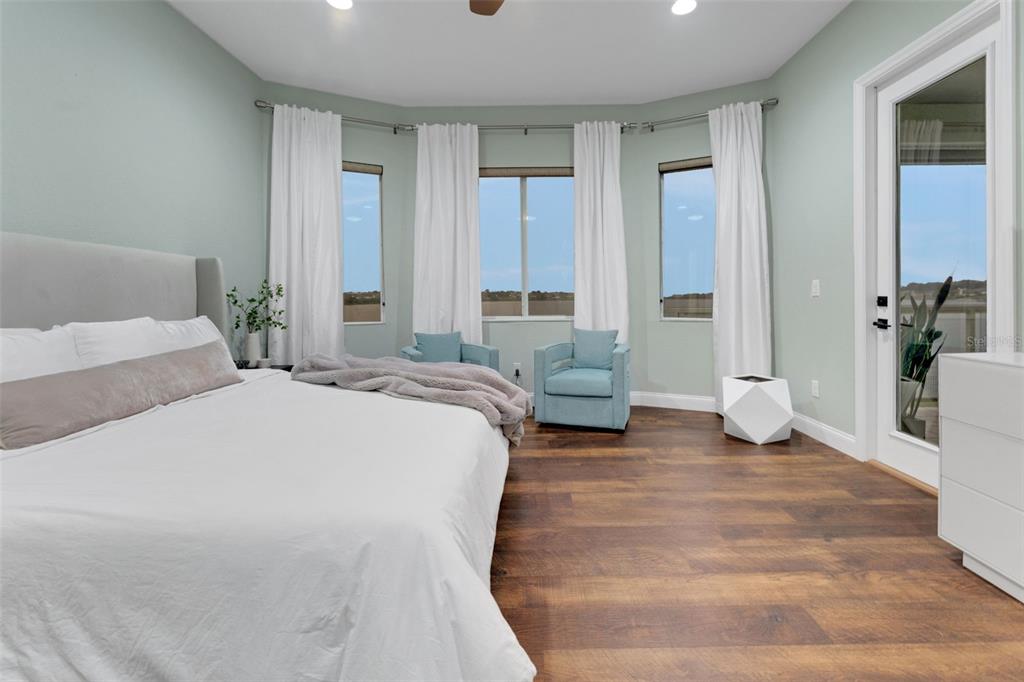 5911 Old Berkley Road Auburndale, FL 33823 - Photo 30 of 91 a spacious bedroom with a bed and glass door