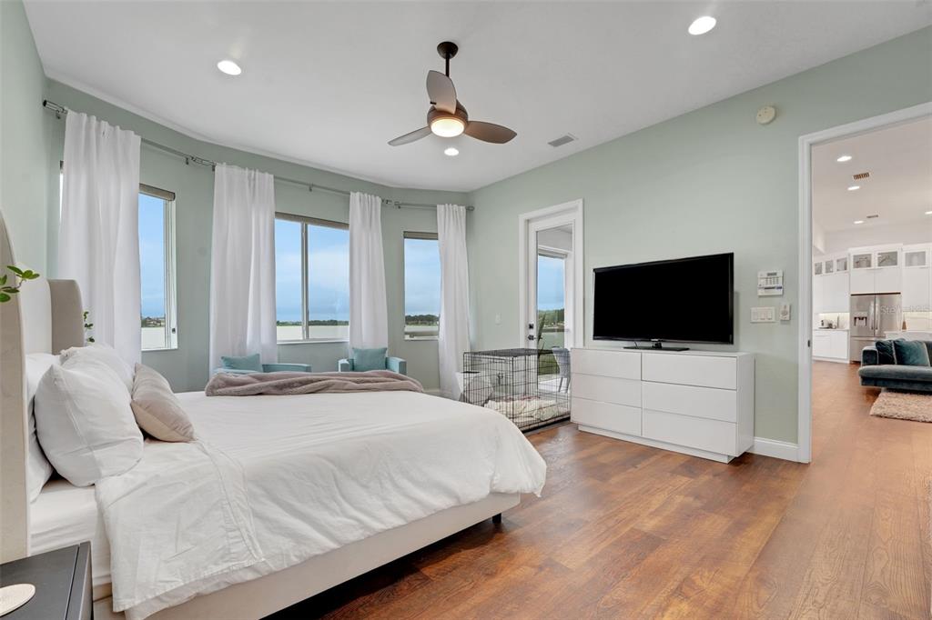 5911 Old Berkley Road Auburndale, FL 33823 - Photo 32 of 91 a bedroom with a bed and a flat screen tv