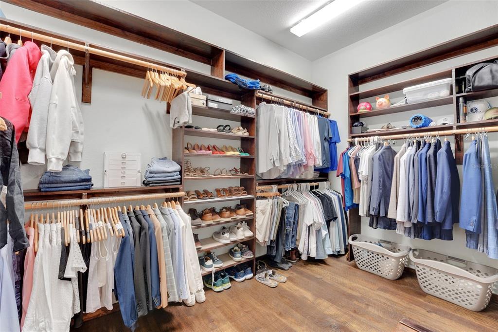 5911 Old Berkley Road Auburndale, FL 33823 - Photo 33 of 91 a view of walk in closet with clothes and shoes