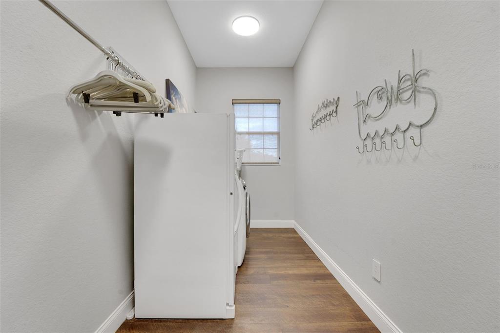 5911 Old Berkley Road Auburndale, FL 33823 - Photo 43 of 91 a view of a hallway with wooden floor and staircase