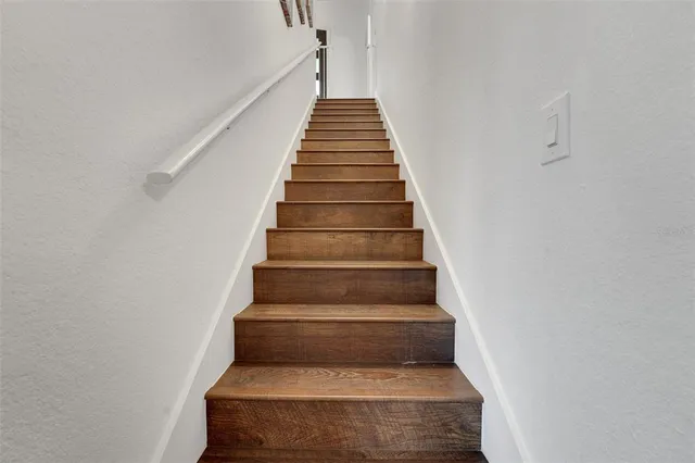 a front view of a house with a yard table and chairs
