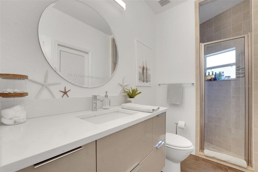 5911 Old Berkley Road Auburndale, FL 33823 - Photo 52 of 91 a bathroom with a sink a toilet and a mirror