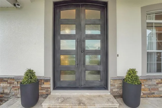 a living room with furniture wooden floor and a flat screen tv
