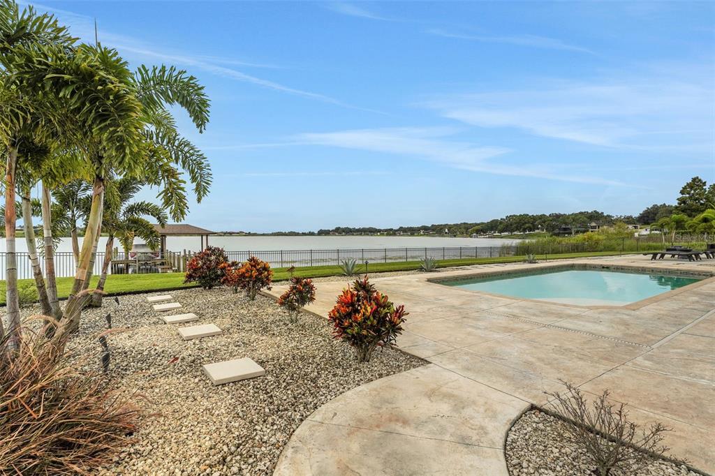 5911 Old Berkley Road Auburndale, FL 33823 - Photo 77 of 91 a view of a lake with a yard