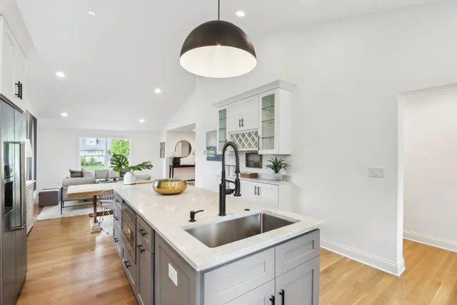 a kitchen with a sink and cabinets