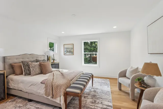 a bedroom with a bed and a couch