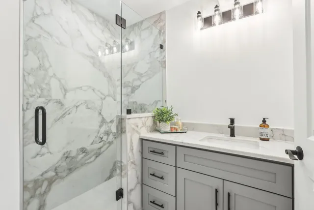 a bathroom with a sink and mirror