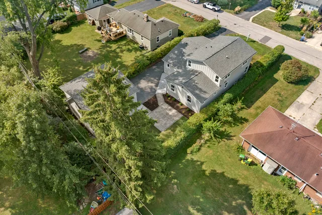 an aerial view of residential houses with outdoor space