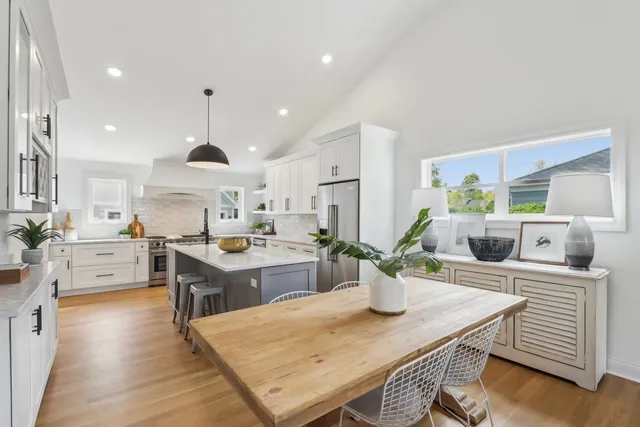 a kitchen with a table and chairs in it