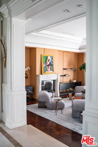 a very nice looking living room with a couch and a potted plant