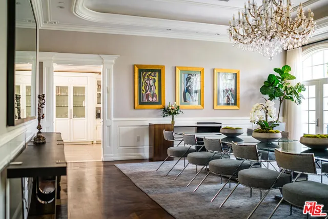 a living room with fireplace furniture and a large window