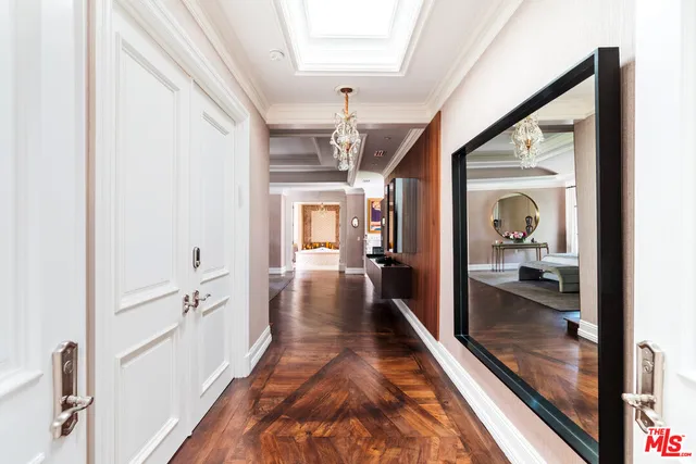 a living room with furniture a fireplace and wooden floor