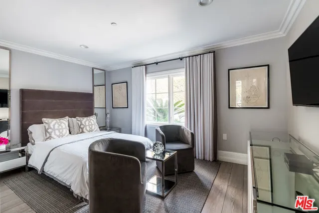 a view of hall way with furniture and window