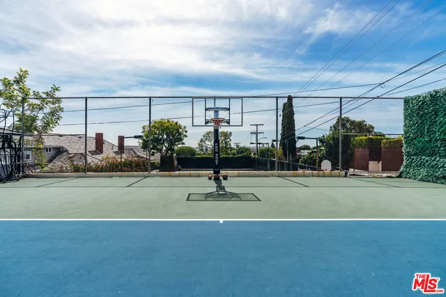 a swimming pool with outdoor seating and garden