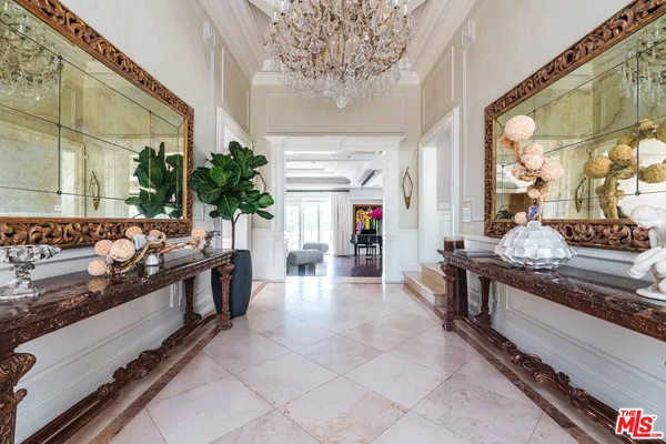 a large kitchen with stainless steel appliances granite countertop a stove and a large window