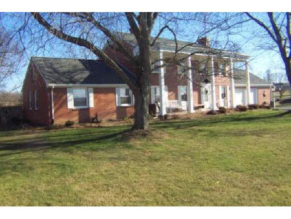 743 Battlefield Road Fort Defiance, VA 24437 - Photo 1 of 12 a front view of a house with a garden