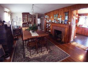 743 Battlefield Road Fort Defiance, VA 24437 - Photo 6 of 12 a living room with furniture a fireplace and a dining table with wooden floor
