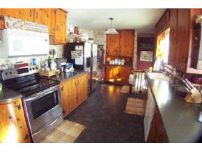 743 Battlefield Road Fort Defiance, VA 24437 - Photo 8 of 12 a kitchen with stainless steel appliances granite countertop a stove a sink and a refrigerator