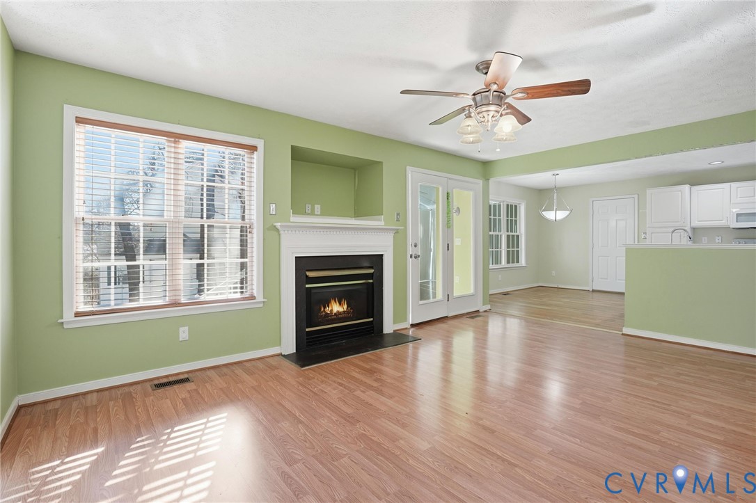 6093 Homehills Road Mechanicsville, VA 23111 - Photo 17 of 50 a view of an empty room with window and wooden floor