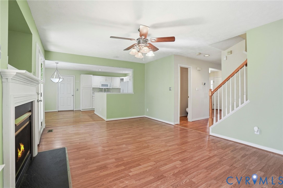 6093 Homehills Road Mechanicsville, VA 23111 - Photo 18 of 50 wooden floor in an empty room with a fireplace