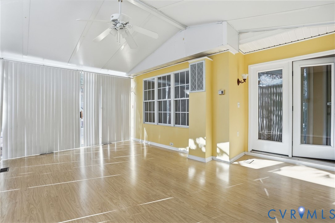 6093 Homehills Road Mechanicsville, VA 23111 - Photo 19 of 50 a view of a livingroom with wooden floor and a ceiling fan