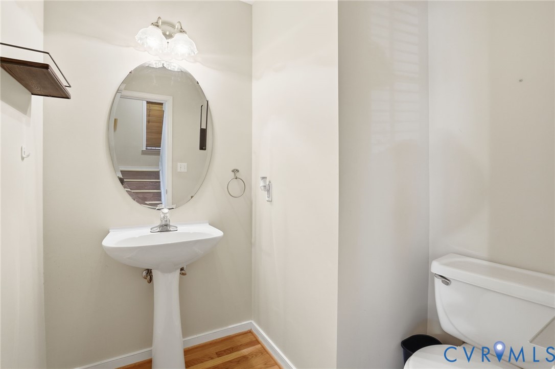 6093 Homehills Road Mechanicsville, VA 23111 - Photo 21 of 50 a bathroom with a toilet sink and mirror