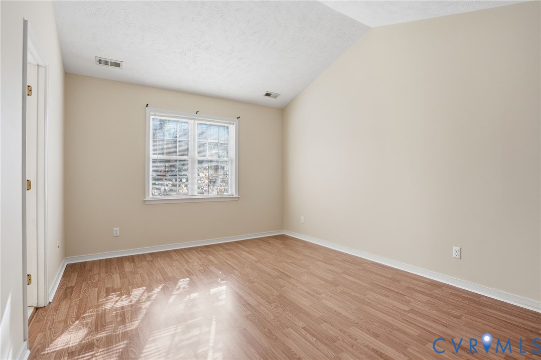 6093 Homehills Road Mechanicsville, VA 23111 - Photo 23 of 50 an empty room with wooden floor and windows