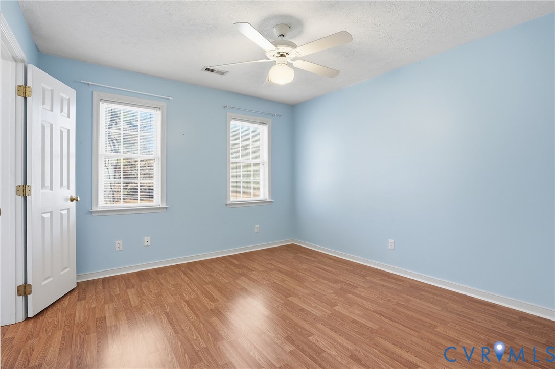 6093 Homehills Road Mechanicsville, VA 23111 - Photo 28 of 50 wooden floor in an empty room with a window