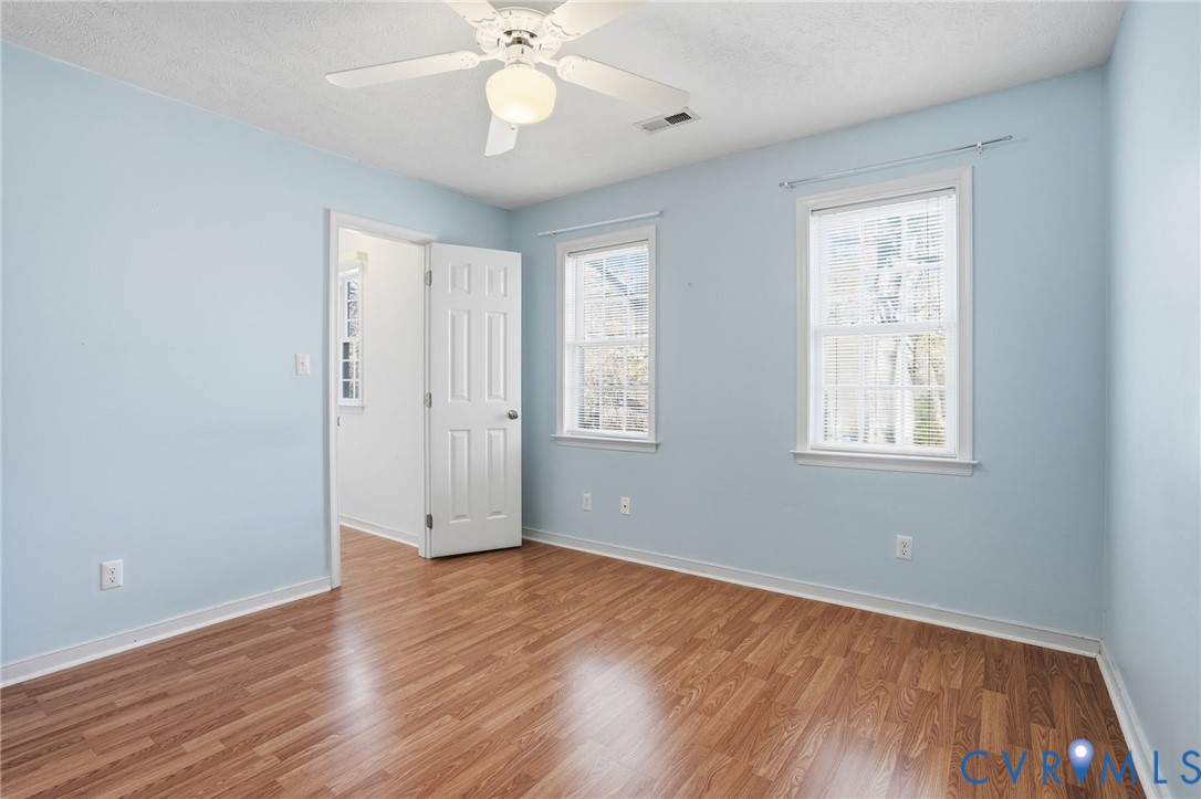 6093 Homehills Road Mechanicsville, VA 23111 - Photo 29 of 50 a view of an empty room with wooden floor and a window