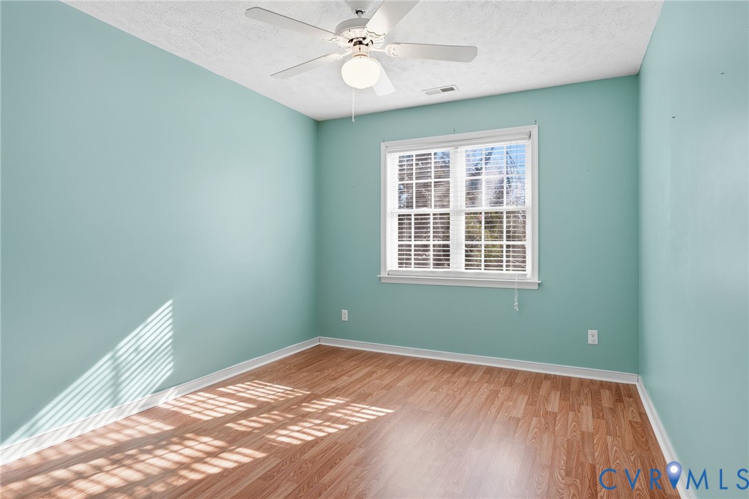 6093 Homehills Road Mechanicsville, VA 23111 - Photo 32 of 50 a view of a room with wooden floor and windows