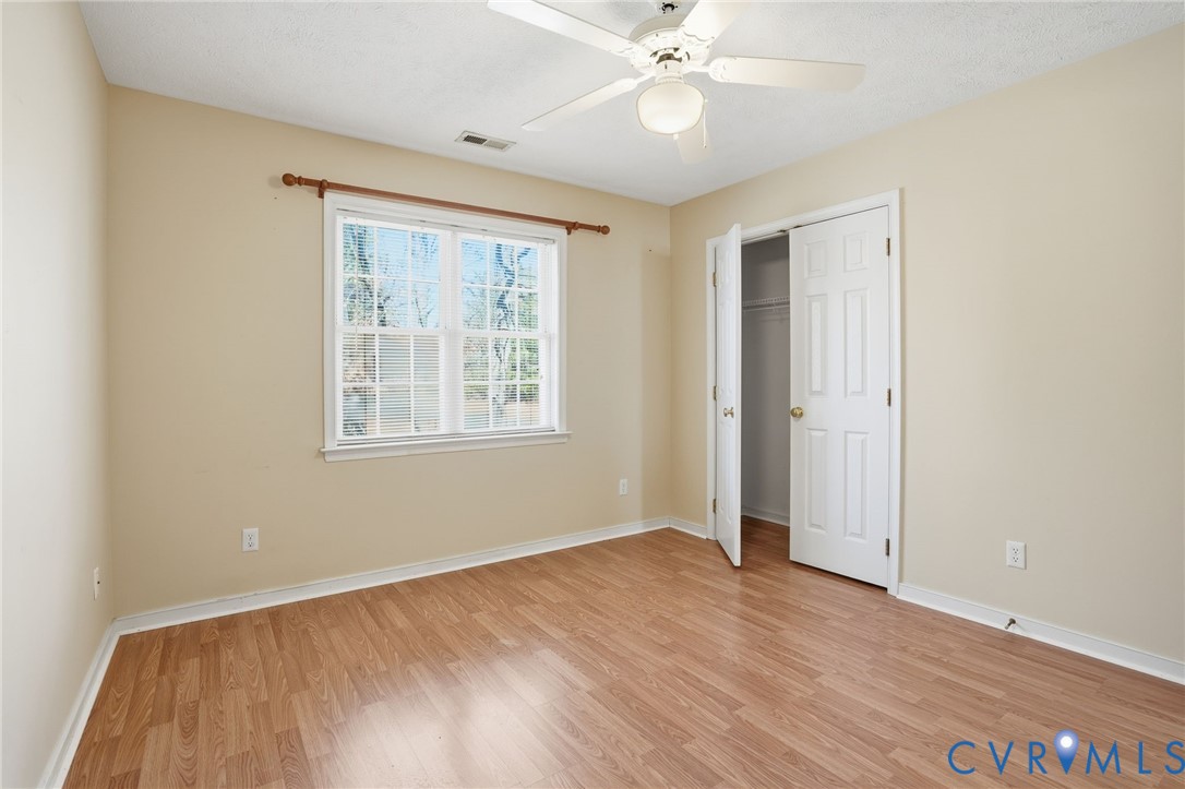 6093 Homehills Road Mechanicsville, VA 23111 - Photo 33 of 50 a view of an empty room with wooden floor and a window