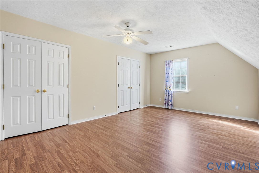 6093 Homehills Road Mechanicsville, VA 23111 - Photo 35 of 50 a view of an empty room with wooden floor and a window