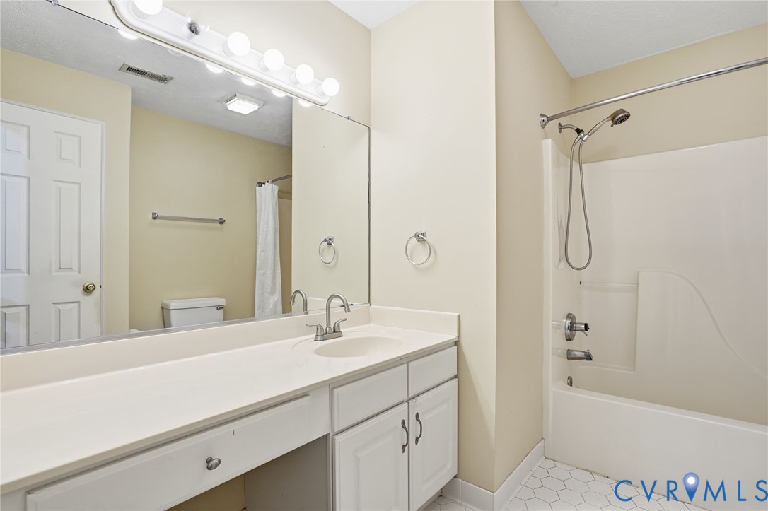 6093 Homehills Road Mechanicsville, VA 23111 - Photo 37 of 50 a bathroom with a tub sink shower and mirror