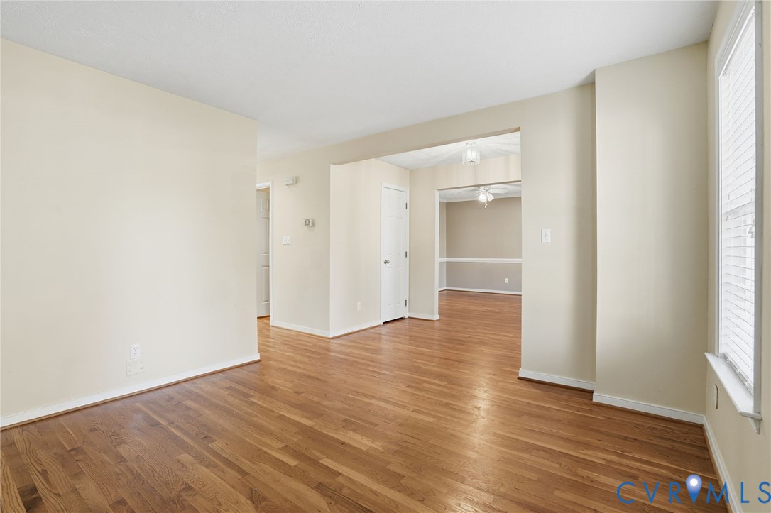 6093 Homehills Road Mechanicsville, VA 23111 - Photo 7 of 50 an empty room with wooden floor & windows
