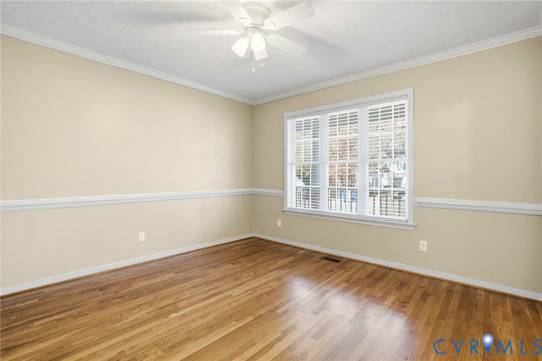 6093 Homehills Road Mechanicsville, VA 23111 - Photo 9 of 50 a view of an empty room with wooden floor and a window