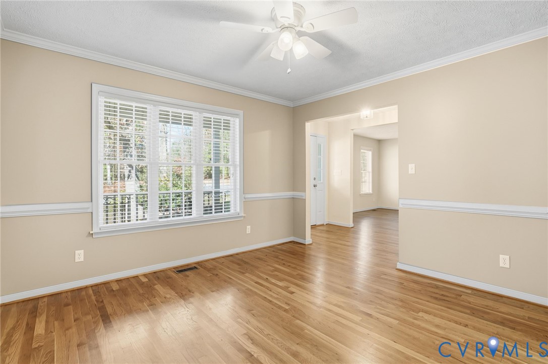 6093 Homehills Road Mechanicsville, VA 23111 - Photo 10 of 50 a view of an empty room with wooden floor and a window