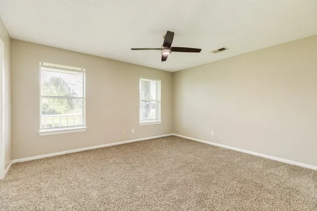 an empty room with windows