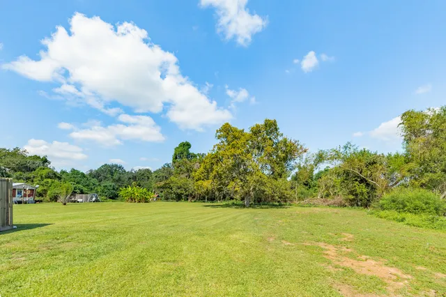 a view of a big yard with an outdoor space and seating