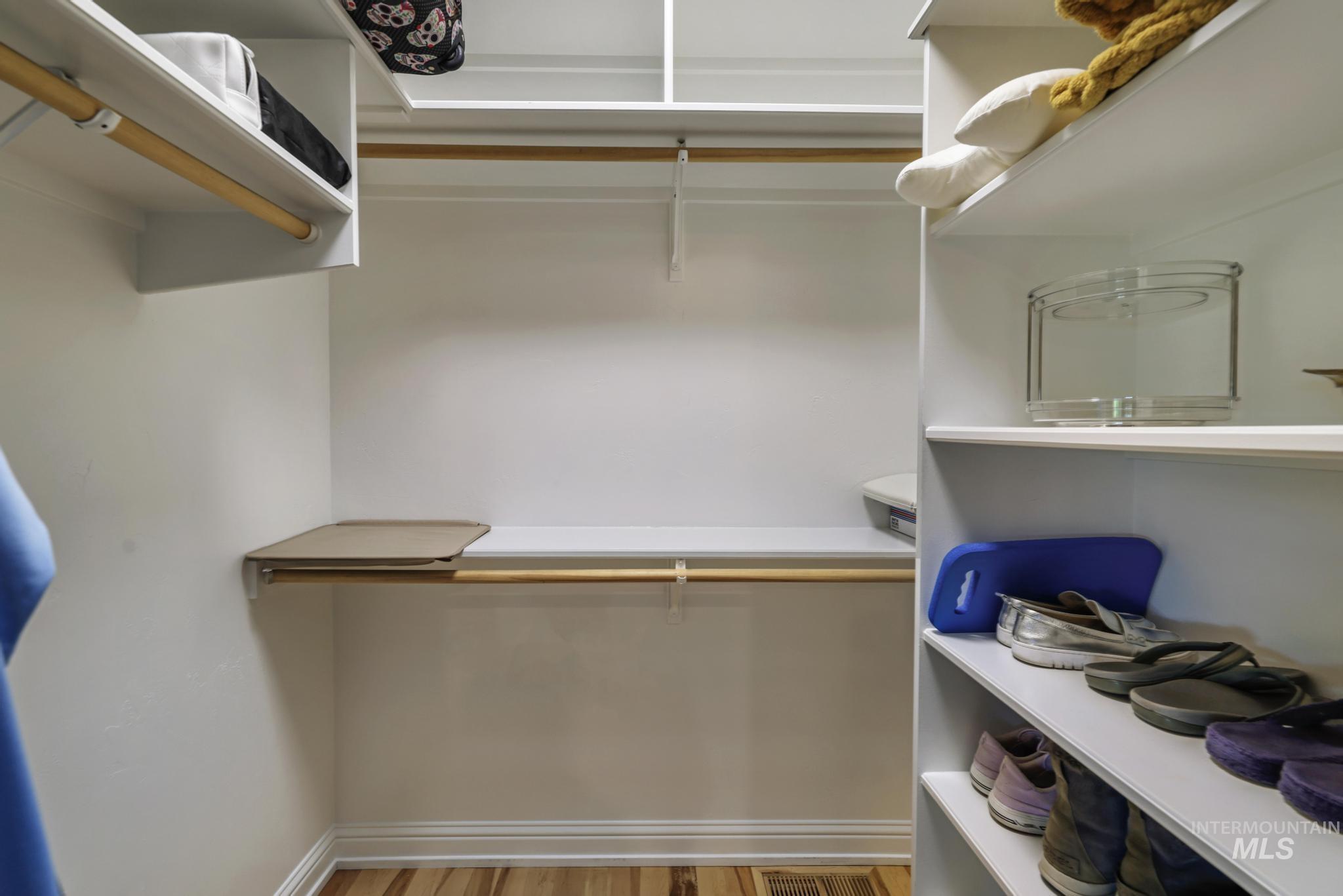 100 Olympic Road Jerome, ID 83338 - Photo 22 of 50 Built-in white shelving system with multiple storage levels and wood-finish flooring