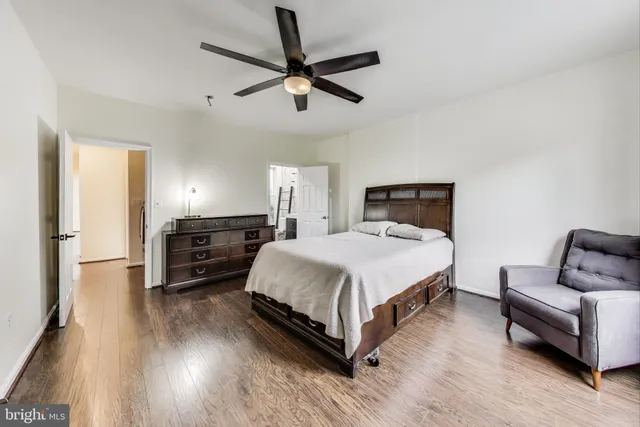 a spacious bedroom with a bed and furniture