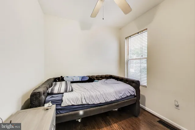a bedroom with a bed and window