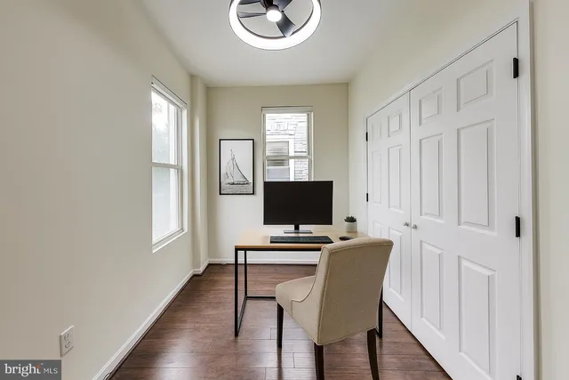 a workspace with furniture and window