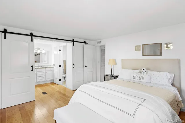 a bedroom with a bed and a walk in closet