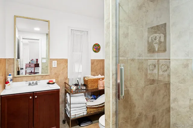 a bathroom with a sink mirror and vanity