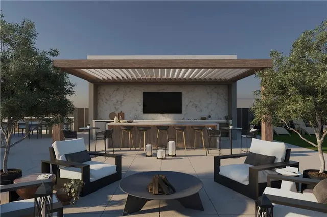 a view of a house with swimming pool and furniture