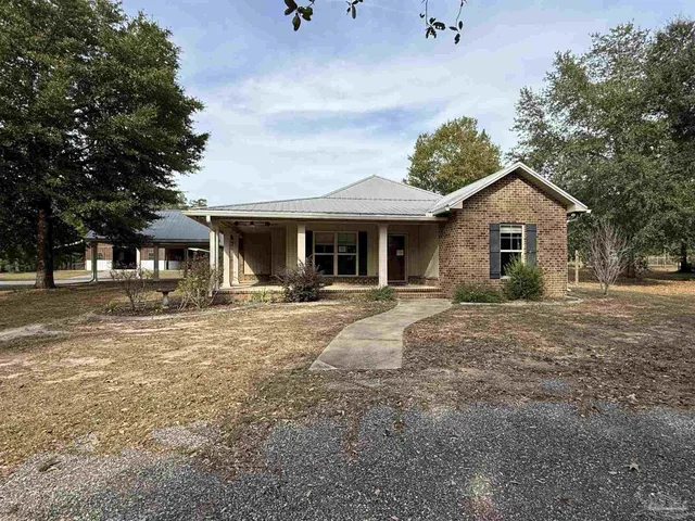 a front view of a house with a porch