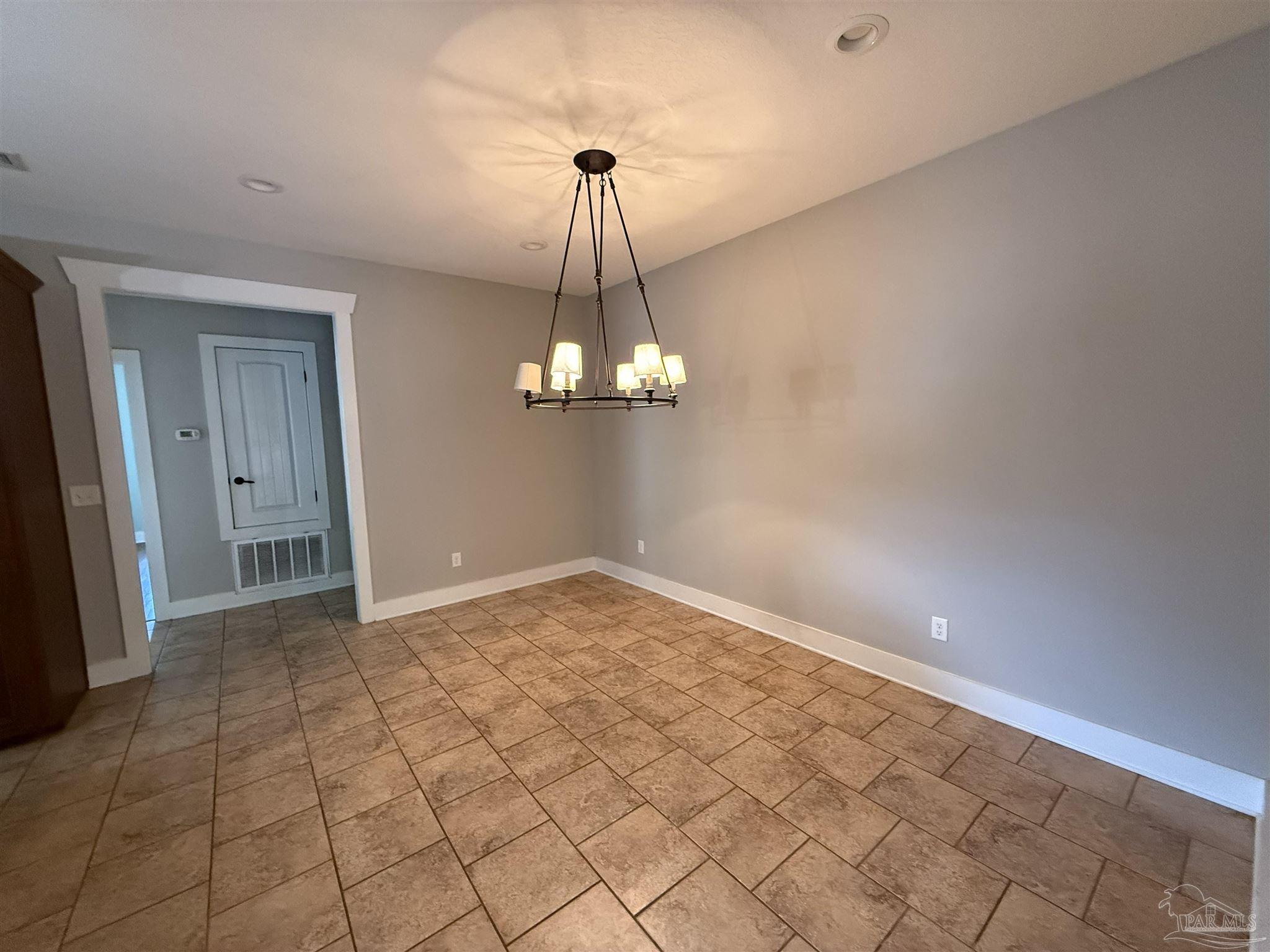 7223 Martin Road Milton, FL 32570 - Photo 16 of 28 a view of empty room with wooden floor