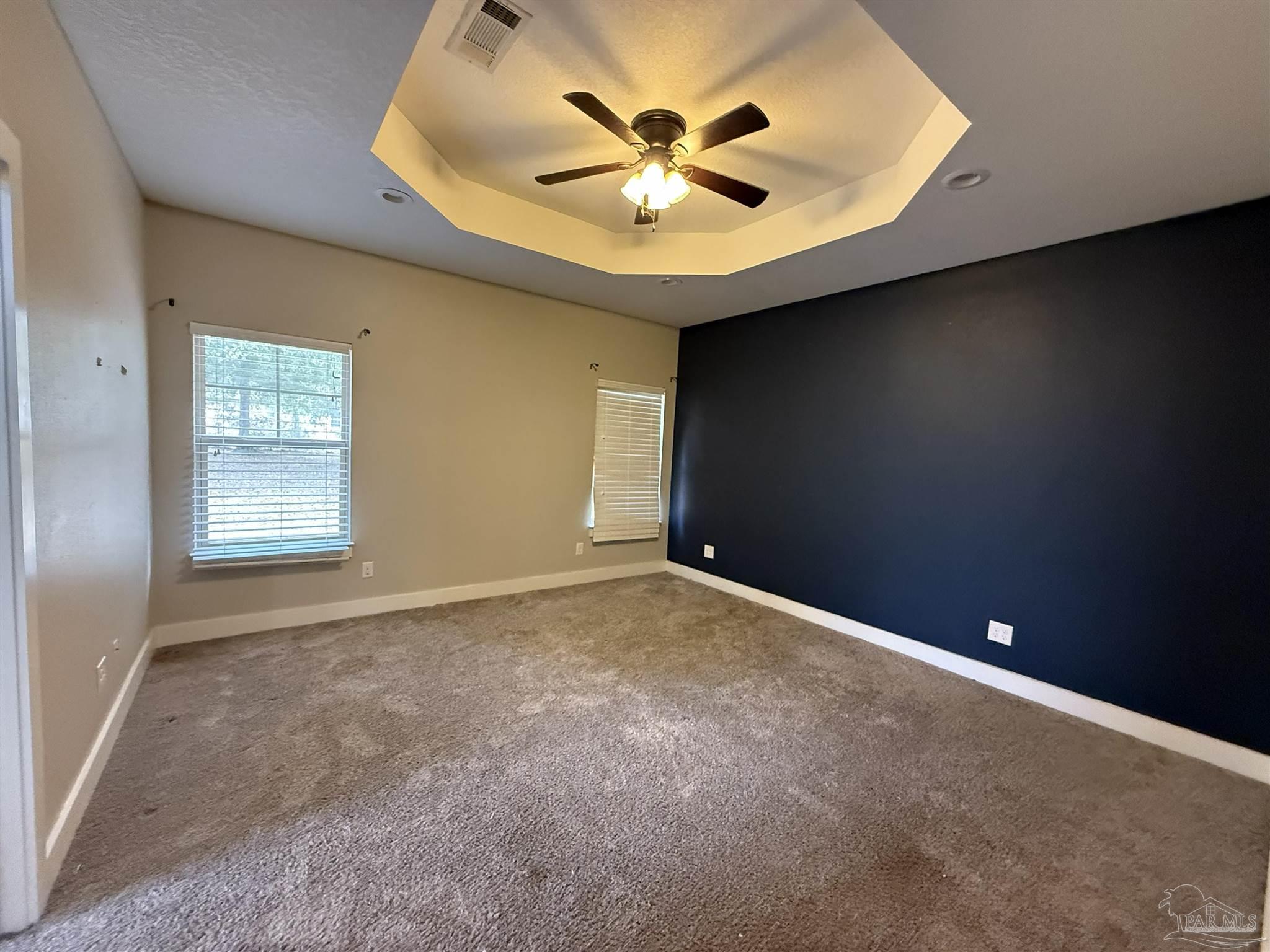7223 Martin Road Milton, FL 32570 - Photo 20 of 28 an empty room with windows and fan