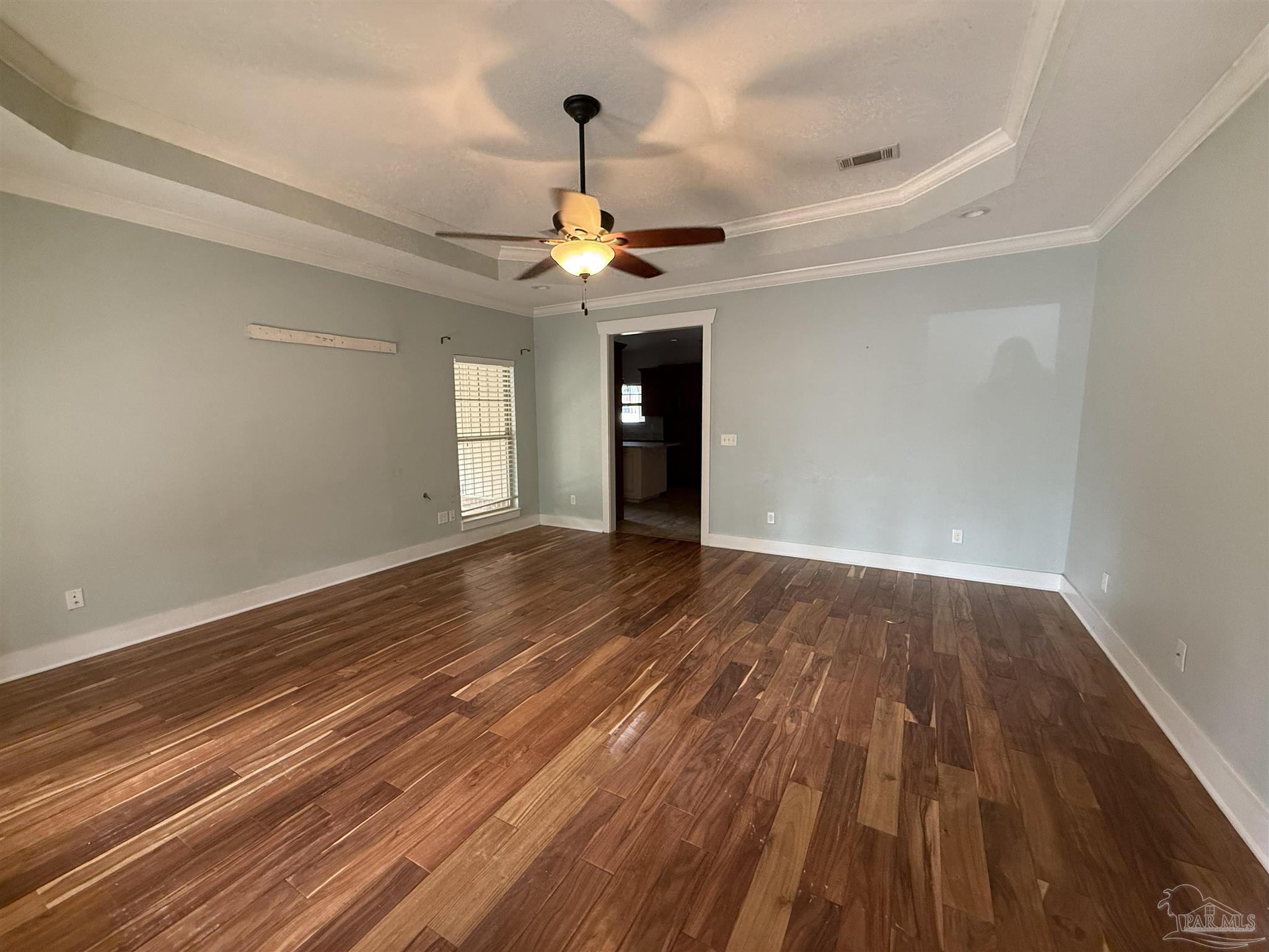 7223 Martin Road Milton, FL 32570 - Photo 2 of 28 wooden floor in an empty room with a window