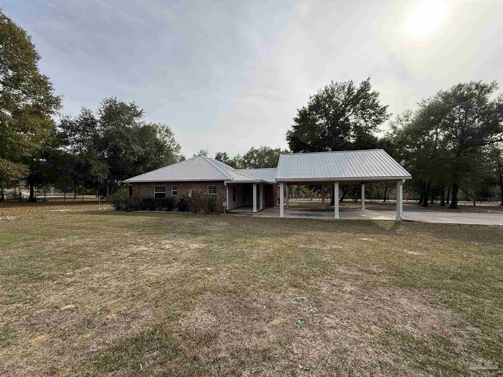 7223 Martin Road Milton, FL 32570 - Photo 28 of 28 a front view of a house with a garden